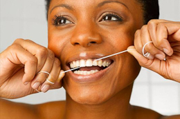 person flossing