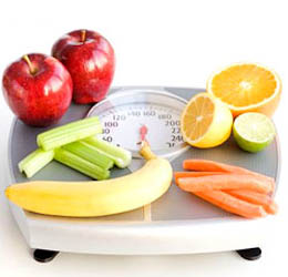 scale with fruits and vegetables